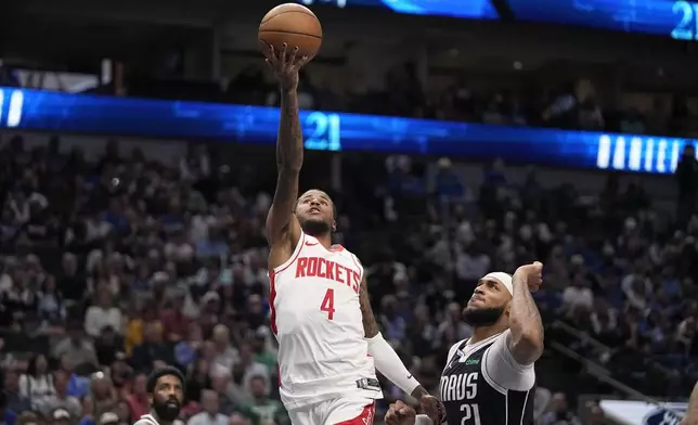 Houston Rockets' Jalen Green (4) shoots as Dallas Mavericks' Daniel Gafford (21) defends in the first half of an NBA basketball game in Dallas, Thursday, Oct. 31, 2024. (AP Photo/Tony Gutierrez)