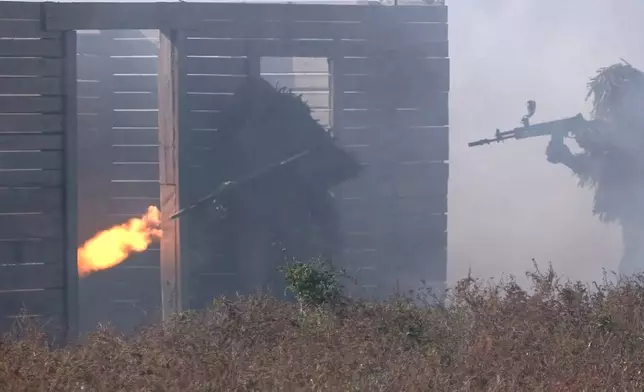 In this image from video released by the Russian Defense Ministry on Friday, Nov. 1, 2024, Russian soldiers attend combat training for assault units at an undisclosed location in Ukraine. (Russian Defense Ministry Press Service via AP)