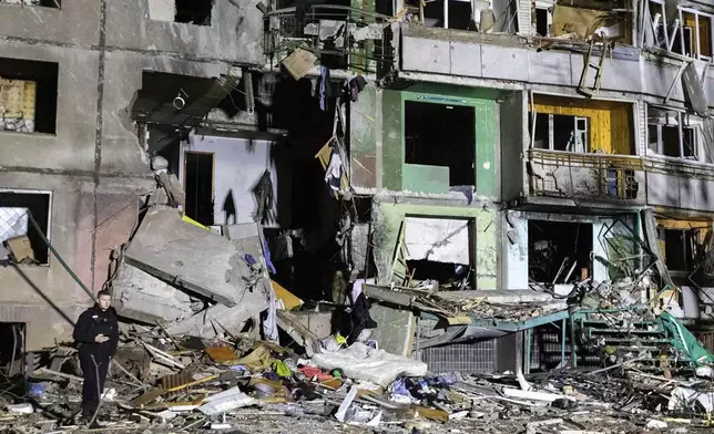 In this photo provided by Kharkiv Regional Administration, an apartment building is seen damaged by a Russian attack in Kharkiv, Ukraine, early Friday, Nov. 8, 2024. (Kharkiv Regional Administration via AP)