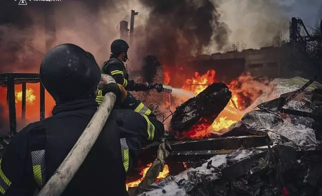 In this photo provided by the Ukrainian Emergency Service on Nov. 13, 2024, Rescue workers put out a fire of a building which was destroyed by a Russian strike in Brovary, outside Kyiv, Ukraine. (Ukrainian Emergency Service via AP)