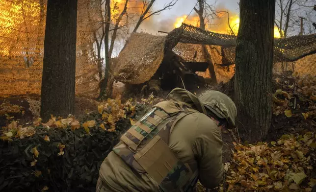 A serviceman of the 13th Brigade of the National Guard of Ukraine fires a Giatsint-B gun towards Russian positions near Kharkiv, Ukraine, Wednesday, Nov. 6, 2024. (AP Photo/Efrem Lukatsky)