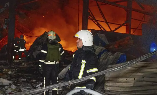 This photo, provided by head of the Odesa Regional Military Administration Oleh Kiper, firefighters work on the site of a damaged building after Russian attack in Odesa, Ukraine, early Friday, Nov. 8, 2024. (Telegram Channel of Odesa Region Governor Oleh Kiper via AP)