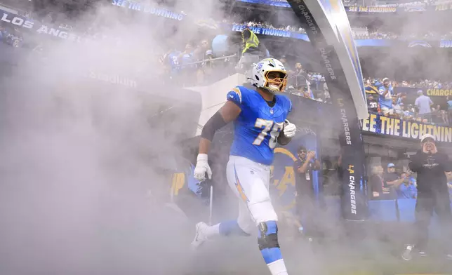 Los Angeles Chargers offensive tackle Joe Alt (76) runs onto the field before an NFL football game against the New Orleans Saints in Inglewood, Calif., Sunday, Oct. 27, 2024. (AP Photo/Ryan Sun)