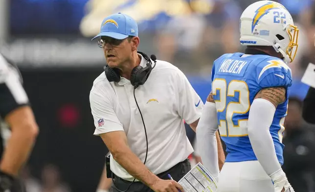 Los Angeles Chargers head coach Jim Harbaugh calls out from the sideline in the first half of an NFL football game against the New Orleans Saints in Inglewood, Calif., Sunday, Oct. 27, 2024. (AP Photo/Mark J. Terrill)