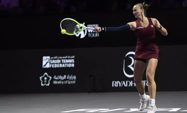 Czech Republic's Barbora Krejcikova shoots against China's Qinwen Zheng during their women's singles semi final match at King Saud University Indoor Arena, in Riyadh, Saudi Arabia, Friday, Nov. 8, 2024. (AP Photo)