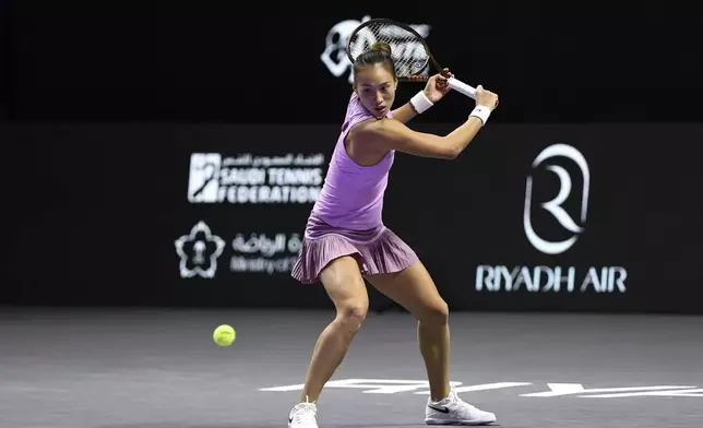 China's Qinwen Zheng shoots the ball during her women's singles semi final match against Czech Republic's Barbora Krejcikova at King Saud University Indoor Arena, in Riyadh, Saudi Arabia, Friday, Nov. 8, 2024. (AP Photo)