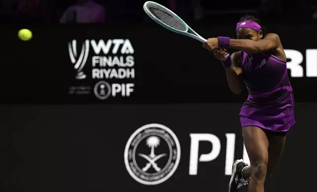 Coco Gauff of the U.S. plays a shot against China's Qinwen Zheng during their women's singles final match of the WTA finals at the King Saud University Indoor Arena, in Riyadh, Saudi Arabia, Saturday, Nov. 9, 2024. (AP Photo)