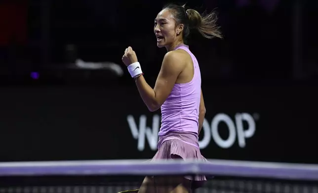 China's Qinwen Zheng reacts after winning a point against Coco Gauff of the U.S. during their women's singles final match of the WTA finals at the King Saud University Indoor Arena, in Riyadh, Saudi Arabia, Saturday, Nov. 9, 2024. (AP Photo)