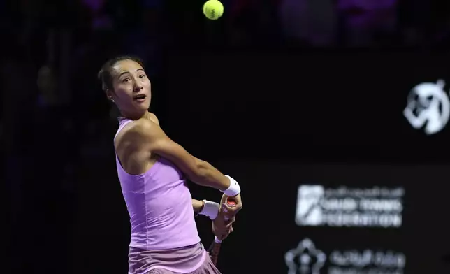 China's Qinwen Zheng plays a shot against Coco Gauff of the U.S. during their women's singles final match of the WTA finals at the King Saud University Indoor Arena, in Riyadh, Saudi Arabia, Saturday, Nov. 9, 2024. (AP Photo)