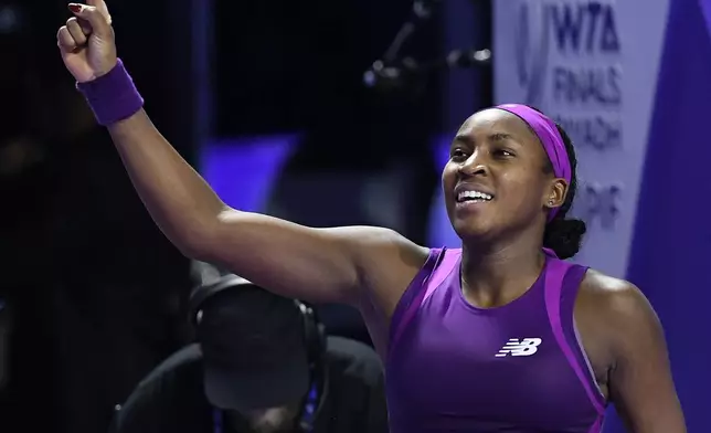 Coco Gauff of the U.S. reacts after winning against China's Qinwen Zheng in their women's singles final match of the WTA finals at the King Saud University Indoor Arena, in Riyadh, Saudi Arabia, Saturday, Nov. 9, 2024. (AP Photo)