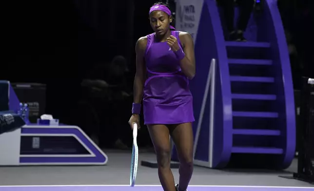 Coco Gauff of the U.S. celebrates a point against China's Qinwen Zheng during their women's singles final match of the WTA finals at the King Saud University Indoor Arena, in Riyadh, Saudi Arabia, Saturday, Nov. 9, 2024. (AP Photo)