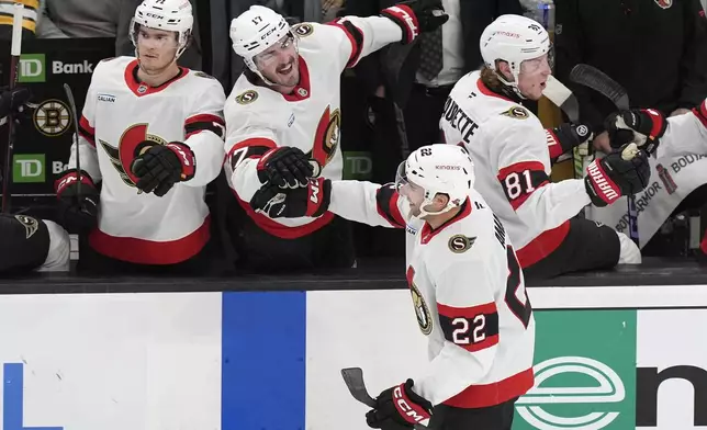 Ottawa Senators' Michael Amadio (22) celebrates his goal with Zack MacEwen (17) during the second period of an NHL hockey game against the Boston Bruins, Saturday, Nov. 9, 2024, in Boston. (AP Photo/Michael Dwyer)