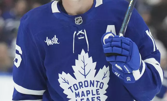 Toronto Maple Leafs' Mitch Marner reacts during the second period of an NHL hockey game against the Ottawa Senators in Toronto, Tuesday, Nov. 12, 2024. (Chris Young/The Canadian Press via AP)