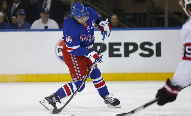 New York Rangers forward Artemi Panarin shoots and scores during the first period of an NHL hockey game against the Ottawa Senators, Friday, Nov. 1, 2024, in New York. (AP Photo/John Munson)