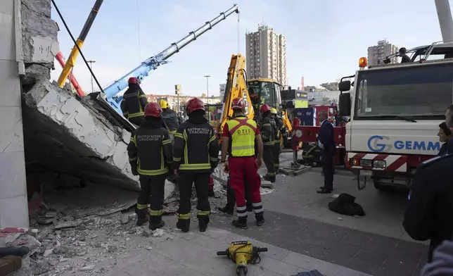 Rescue service workers inspect a scene as a roof collapsed at a railway station, Friday Nov. 1, 2024, in Novi Sad, Serbia. (Interior Ministry of Serbia via AP)