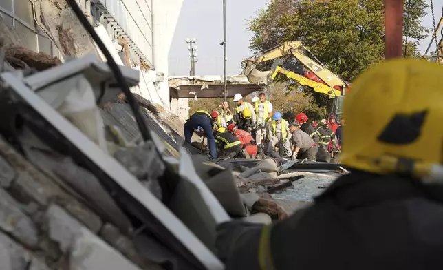 Rescue service workers inspect a scene as a roof collapsed at a railway station, Friday Nov. 1, 2024, in Novi Sad, Serbia. (AP Photo/Interior Ministry of Serbia/HO)