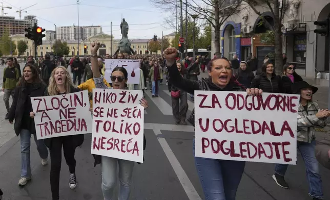 Protesters shout slogans and demand arrests, two days after a concrete canopy collapsed at a railway station in Novi Sad, killing 14 people and injuring three, during protest in Belgrade, Serbia, Sunday, Nov. 3, 2024. (AP Photo/Darko Vojinovic)