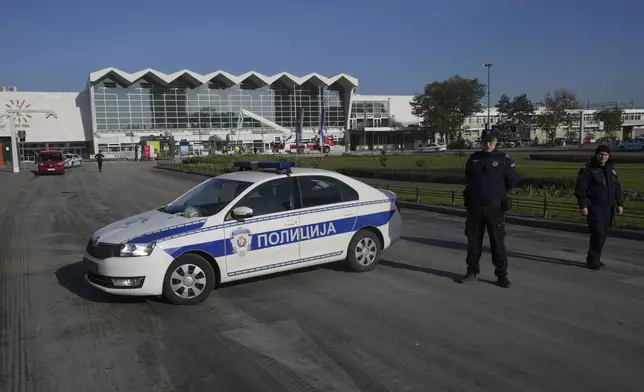 Police officers guard a train station after an outdoor roof collapsed on Friday, in Novi Sad, Serbia, Saturday, Nov. 2, 2024. (AP Photo/Darko Vojinovic)