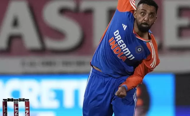 India's bowler Varun Chakravarthy bowls during the T20 International cricket match between South Africa and India, at Kingsmead stadium in Durban, South Africa, Friday, Nov. 8, 2024. (AP Photo/Themba Hadebe)