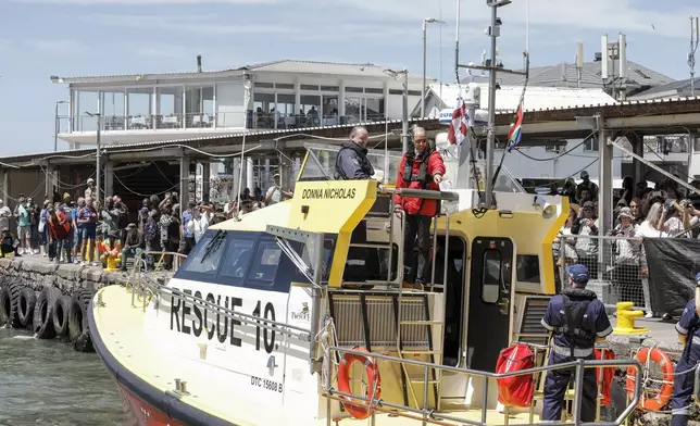 Britain's Prince William, the Prince of Wales, arrives on board a National Sea Rescue Institute (NSRI) boat to meet 2023 Earthshot finalist ABALOBI, at Kalk Bay Harbour, near Cape Town, Thursday, Nov. 7, 2024. (Gianluigi Guercia/Pool Photo via AP)