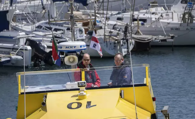 Britain's Prince William sails off with volunteers of the National Sea Rescue Initiative, at Simon's Town harbour near Cape Town, South Africa, Thursday, Nov. 7, 2024. (AP Photo/Jerome Delay, Pool)