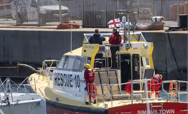 Britain's Prince William sails off with volunteers of the National Sea Rescue Initiative, at Simon's Town harbour near Cape Town, South Africa, Thursday, Nov. 7, 2024. (AP Photo/Jerome Delay, Pool)