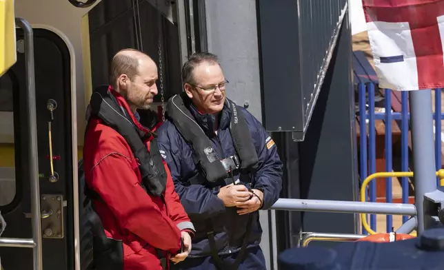 Britain's Prince William sails off with volunteers of the National Sea Rescue Initiative, at Simon's Town harbour near Cape Town, South Africa, Thursday, Nov. 7, 2024. (AP Photo/Jerome Delay, Pool)