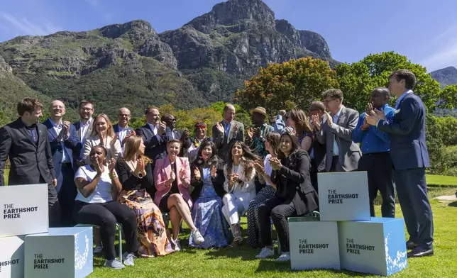 Britain's Prince William poses with finalists of the 2024 Earthshot Prize at the Kirstenbosch Botanical Gardens in Cape Town, South Africa, Wednesday, Nov. 6, 2024. (AP Photo/Jerome Delay, Pool)