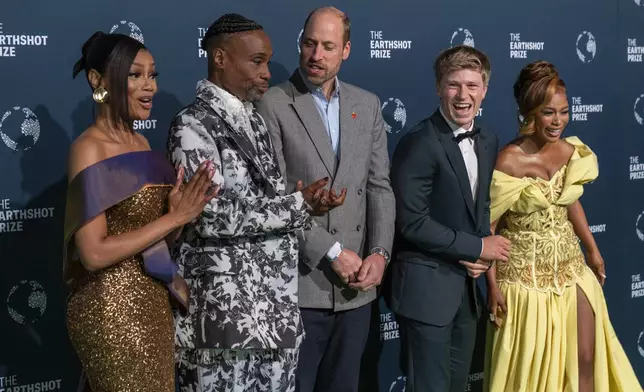 Britain's Prince William, center, laughs with, from left, Bonang Matheba, Billy Porter, Robert Irwin and Nomzamo Mbatha before the start of the Earthshot Prize Award ceremony in Cape Town, South Africa, Wednesday, Nov. 6, 2024. (AP Photo/Jerome Delay)