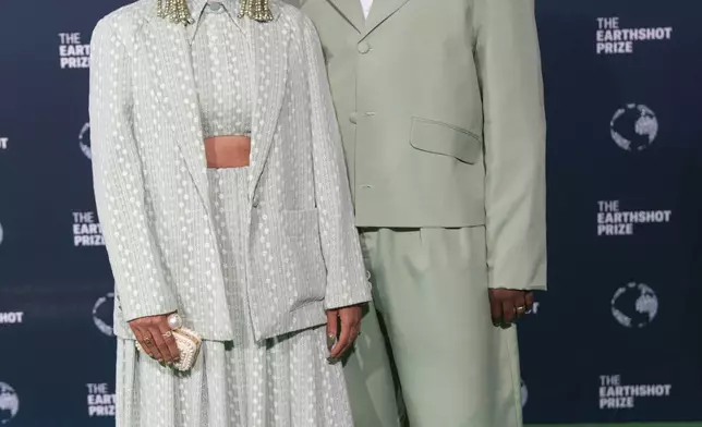 American rapper Tobe Nwigwe and his wife Martica Ivory "Fat" Nwigwe pose on the green carpet before the start of the Earthshot Prize Award ceremony in Cape Town, South Africa, Wednesday, Nov. 6, 2024. (AP Photo/Jerome Delay)