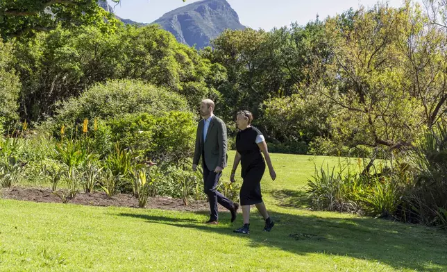 Britain's Prince William, accompanied by Earthshot Prize CEO Hannah Jones, walks through the Kirstenbosch Botanical Gardens in Cape Town, South Africa, Wednesday, Nov. 6, 2024. (AP Photo/Jerome Delay, Pool)