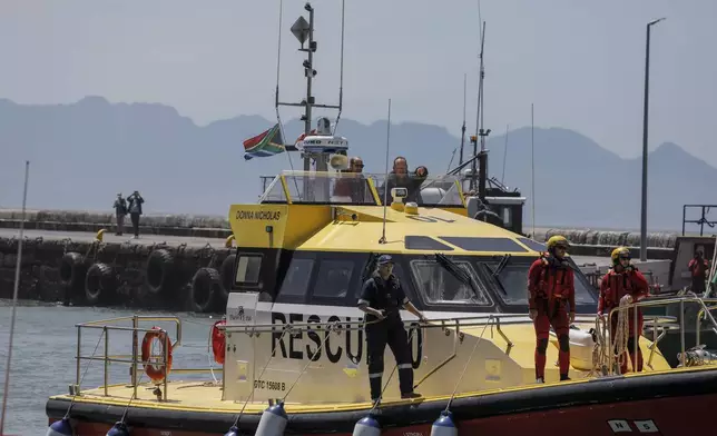 Britain's Prince William, the Prince of Wales, arrives on board a National Sea Rescue Institute (NSRI) boat to meet 2023 Earthshot finalist ABALOBI, at Kalk Bay Harbour, near Cape Town, Thursday, Nov. 7, 2024. (Gianluigi Guercia/Pool Photo via AP)