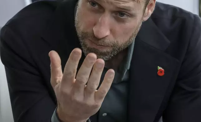 Britain's Prince William, speaks to a group of young people at the Earthshot Prize Climate Leaders Youth Programme at Rooftop on Bree in Cape Town, South Africa, Monday Nov. 4, 2024. (Gianluigi Guercia/Pool Photo via AP)