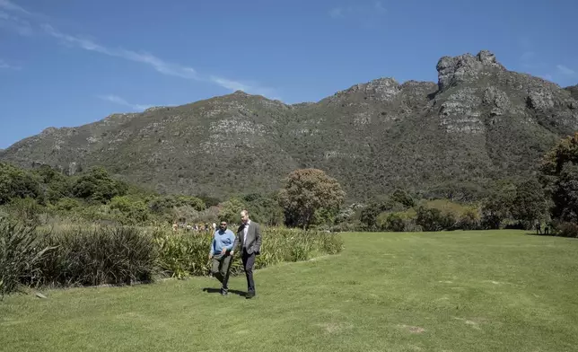 Britain's Prince William, Prince of Wales, center right, walks with Garden Director Werner Voigt before a meeting with the 2024 Earthshot Prize Finalists, at Kirstenbosch National Botanical Garden in Cape Town, South Africa, Wednesday, Nov. 6, 2024. (Gianluigi Guercia, Pool Photo via AP)