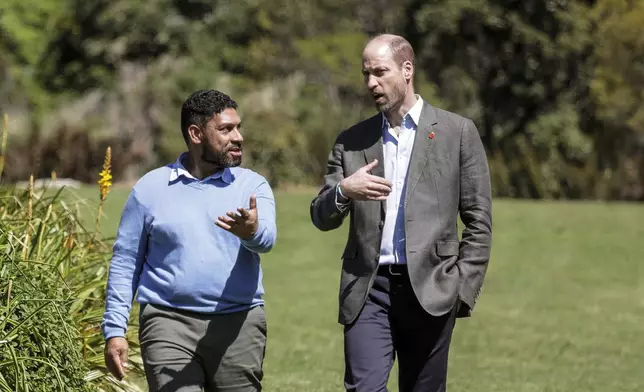 Britain's Prince William, Prince of Wales, right, walks with Garden Director Werner Voigt before a meeting with the 2024 Earthshot Prize Finalists, at Kirstenbosch National Botanical Garden in Cape Town, South Africa, Wednesday, Nov. 6, 2024. (Gianluigi Guercia, Pool Photo via AP)