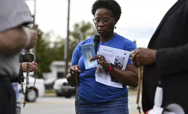 Protestors gather for prayer prior to the scheduled execution of Richard Moore, Friday, Nov. 1, 2024, outside of Broad River Correctional Institution in Columbia, S.C. (AP Photo/Matt Kelley)