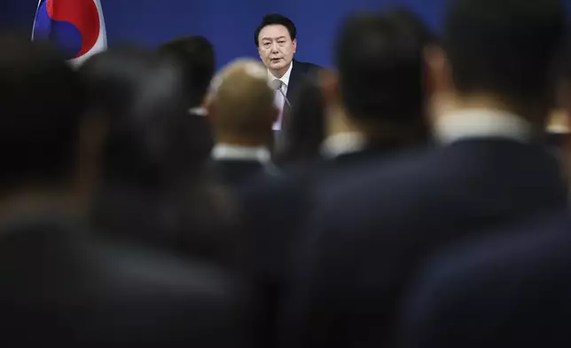 South Korean President Yoon Suk Yeol answers a reporters' question during a news conference at the Presidential Office in Seoul, South Korea Thursday, Nov. 7, 2024. (Kim Hong-Ji/Pool Photo via AP)