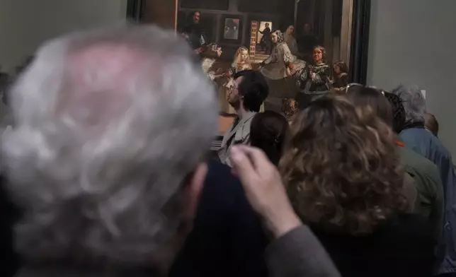 Novelist John Banville looks at 'Diego Velazquez's 'Las Meninas' at the Prado Museum in Madrid, Spain, Wednesday, Oct. 23, 2024. Banville has enjoyed unlimited access to Madrid's great El Prado museum for the past month as its latest writer-in-residence. (AP Photo/Paul White)