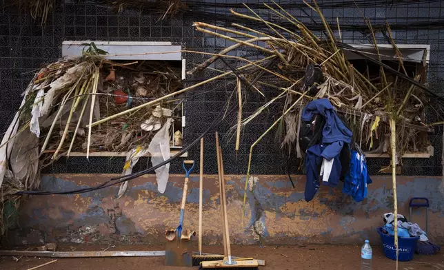 The windows of a house affected by floods are pictured in Paiporta, at the epicenter of the floods, near Valencia, Spain, Saturday, Nov. 2, 2024. (AP Photo/Manu Fernandez)