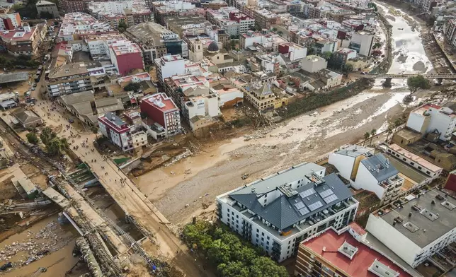 Mud covers the area in the aftermath of last Tuesday and early Wednesday storm that left hundreds dead or missing in the region, in Paiporta, outskirts of Valencia, Spain, Saturday, Nov. 2, 2024.(AP Photo/Angel Garcia)