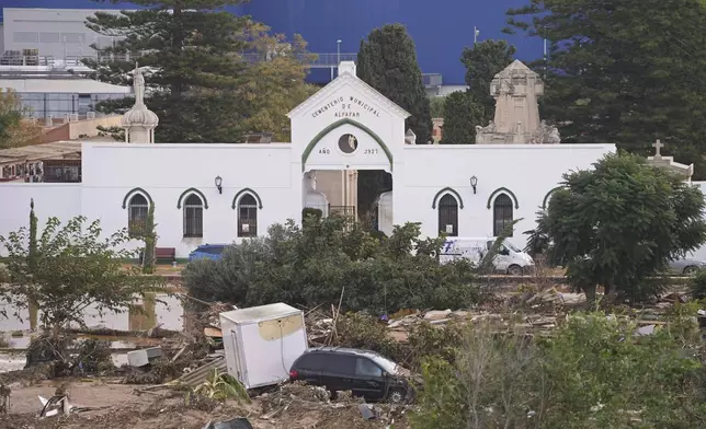 Damage is seen outside a cemetery on the outskirts of Valencia, Spain, Friday, Nov. 1, 2024 after flooding. (AP Photo/Alberto Saiz)