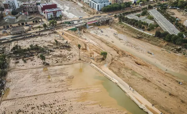 Mud covers the area after last Tuesday and early Wednesday storm that left hundreds dead or missing in Paiporta, outskirts of Valencia, Spain, Saturday, Nov. 2, 2024.(AP Photo/Angel Garcia)