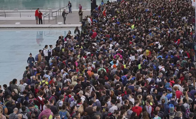 Thousands of volunteers show up at the City of Arts and Sciences cultural complex to be assigned work schedules to help with the clean up operation after floods in Valencia, Spain, Saturday, Nov. 2, 2024. (AP Photo/Alberto Saiz)