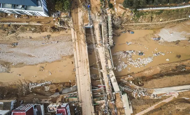 Mud covers the area in the aftermath last Tuesday and early Wednesday storm that left hundreds dead or missing in Paiporta, outskirts of Valencia, Spain, Saturday, Nov. 2, 2024.(AP Photo/Angel Garcia)