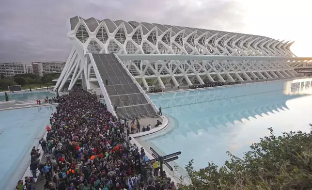 Thousands of volunteers show up at the City of Arts and Sciences cultural complex to be assigned work schedules to help with the clean up operation after floods in Valencia, Spain, Saturday, Nov. 2, 2024. (AP Photo/Alberto Saiz)