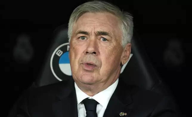 Real Madrid's head coach Carlo Ancelotti grimaces before the Spanish La Liga soccer match between Real Madrid and Osasuna at the Santiago Bernabeu stadium in Madrid, Spain, Saturday, Nov. 9, 2024. (AP Photo/Jose Breton)