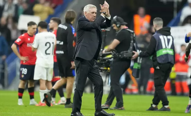 Real Madrid's head coach Carlo Ancelotti applauds at the end of the Spanish La Liga soccer match between Real Madrid and Osasuna at the Santiago Bernabeu stadium in Madrid, Spain, Saturday, Nov. 9, 2024. (AP Photo/Jose Breton)