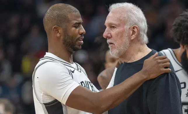 San Antonio Spurs guard Chris Paul has a word with Spurs head coach Gregg Popovich, during the second half of an NBA basketball game against the Utah Jazz, Thursday, Oct. 31, 2024, in Salt Lake City. (AP Photo/Rick Egan)