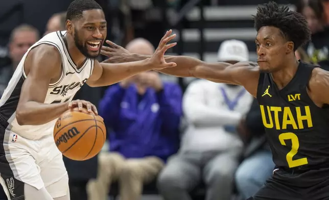 Utah Jazz guard Collin Sexton (2) guards San Antonio Spurs guard Malaki Branham (22), during the first half of an NBA basketball game, Thursday, Oct. 31, 2024, in Salt Lake City. (AP Photo/Rick Egan)