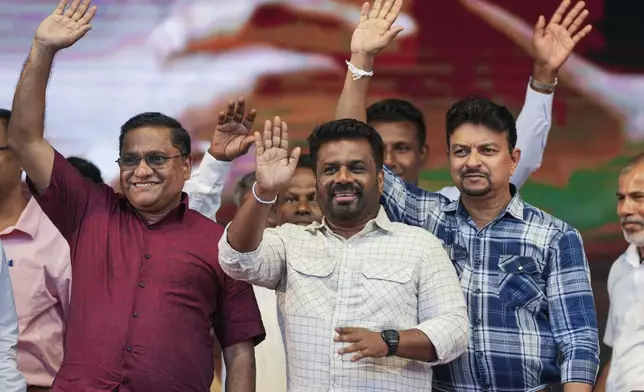 Sri Lankan President Anura Kumara Dissanayake waves with other candidates during a public rally ahead of Thursday's parliamentary election in Gampaha, Sri Lanka, Monday, Nov. 11, 2024. (AP Photo/Eranga Jayawardena)